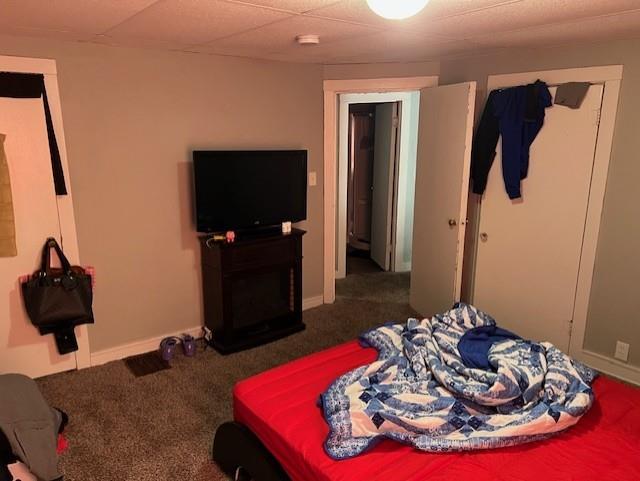 carpeted bedroom with baseboards