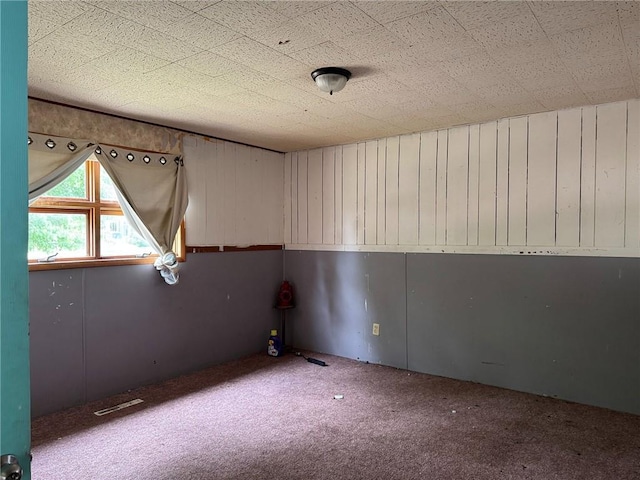 carpeted spare room with visible vents