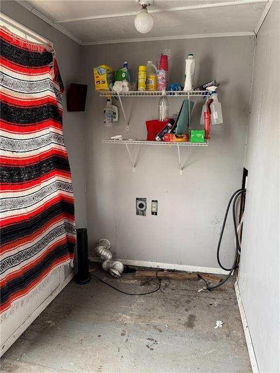 washroom with ornamental molding, laundry area, and hookup for a washing machine