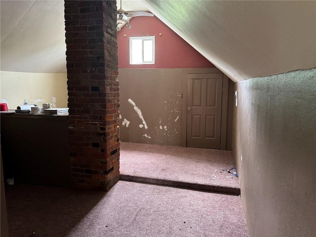 bonus room with carpet flooring and lofted ceiling