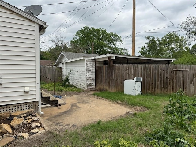 view of yard featuring fence and a patio area