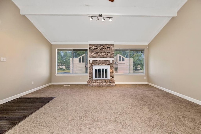 unfurnished living room with carpet floors, baseboards, and a brick fireplace