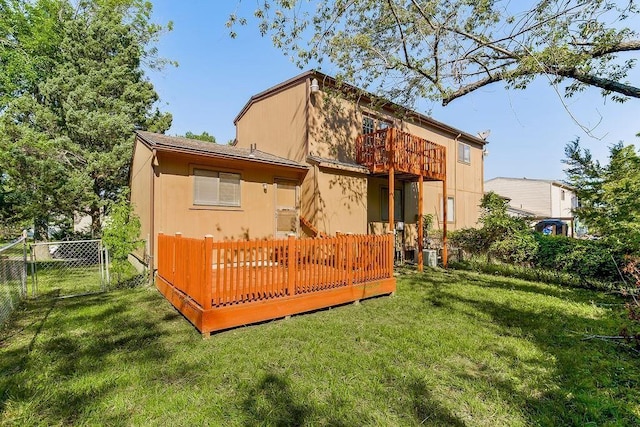 back of property featuring a deck and a gate