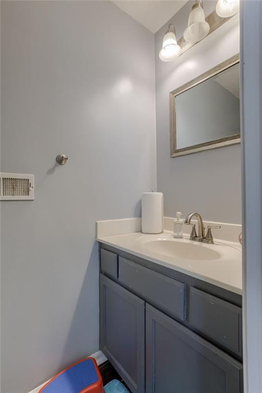 8403 NE 115th Ter, Kansas City, MO 64157 - bathroom featuring vanity