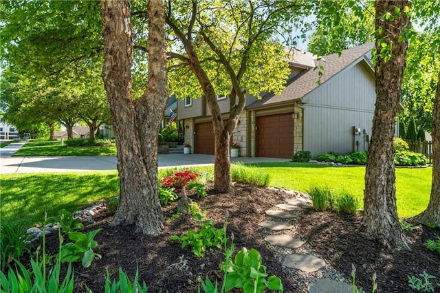 9808 N Hedges Ave, Kansas City, MO 64157 - view of front of house with a shingled roof, a front yard, concrete driveway, and a garage