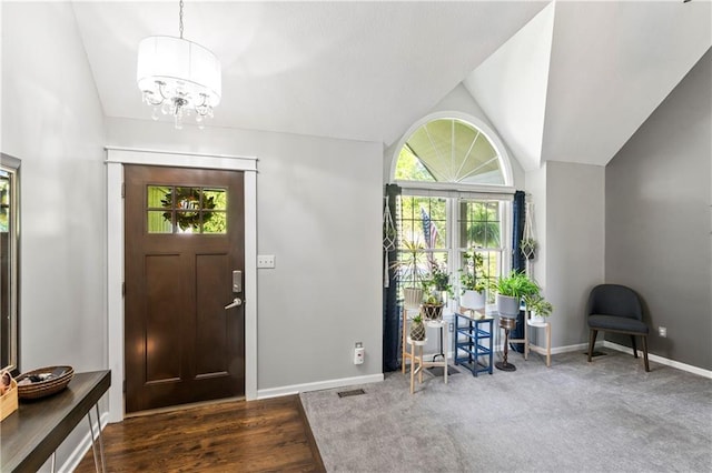 9808 N Hedges Ave, Kansas City, MO 64157 - entrance foyer featuring vaulted ceiling, a chandelier, and baseboards