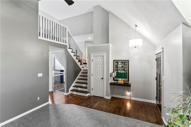 9808 N Hedges Ave, Kansas City, MO 64157 - entrance foyer featuring stairs, a chandelier, high vaulted ceiling, carpet floors, and baseboards