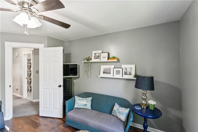 9808 N Hedges Ave, Kansas City, MO 64157 - sitting room with wood finished floors, a ceiling fan, and baseboards