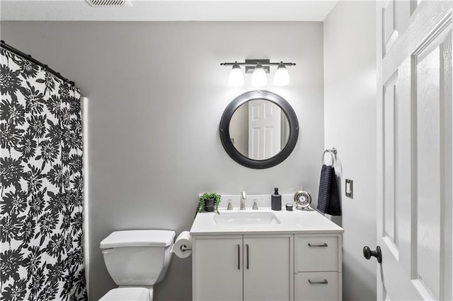9808 N Hedges Ave, Kansas City, MO 64157 - bathroom featuring toilet, vanity, and a shower with shower curtain
