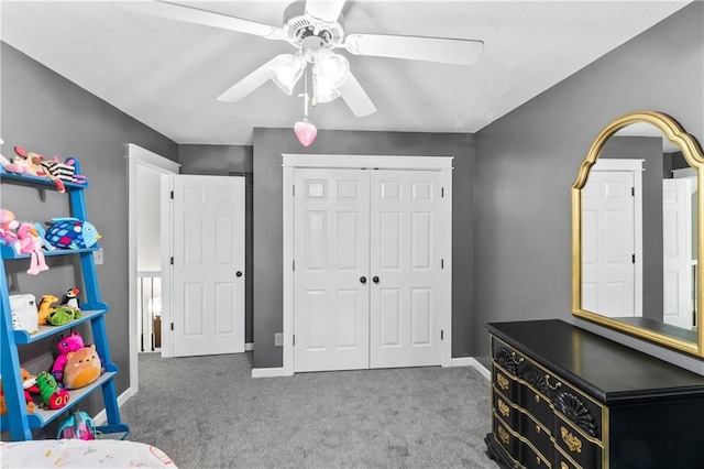9808 N Hedges Ave, Kansas City, MO 64157 - bedroom with carpet floors, a closet, a ceiling fan, and baseboards