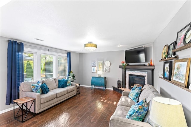 9808 N Hedges Ave, Kansas City, MO 64157 - living area with a fireplace, wood finished floors, and baseboards