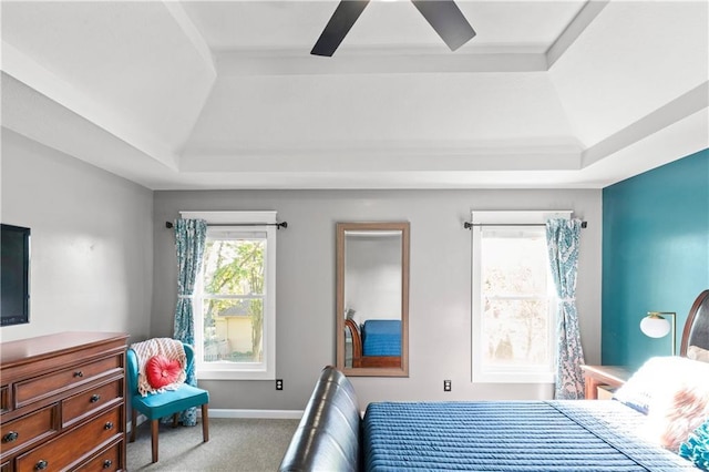 9808 N Hedges Ave, Kansas City, MO 64157 - carpeted bedroom featuring a raised ceiling and a ceiling fan