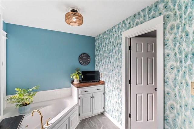 9808 N Hedges Ave, Kansas City, MO 64157 - full bathroom with wallpapered walls, a tub with jets, marble finish flooring, and baseboards