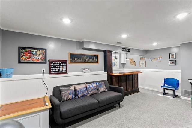 9808 N Hedges Ave, Kansas City, MO 64157 - living room with a dry bar, carpet flooring, crown molding, recessed lighting, and a wainscoted wall
