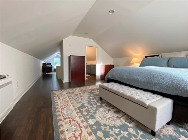 bedroom featuring dark wood-style floors, vaulted ceiling, and baseboards
