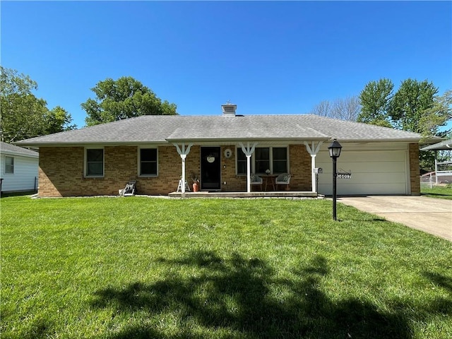 ranch-style house with covered porch, an attached garage, a front yard, driveway, and brick siding