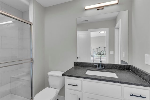 full bathroom with vanity, toilet, visible vents, and a stall shower