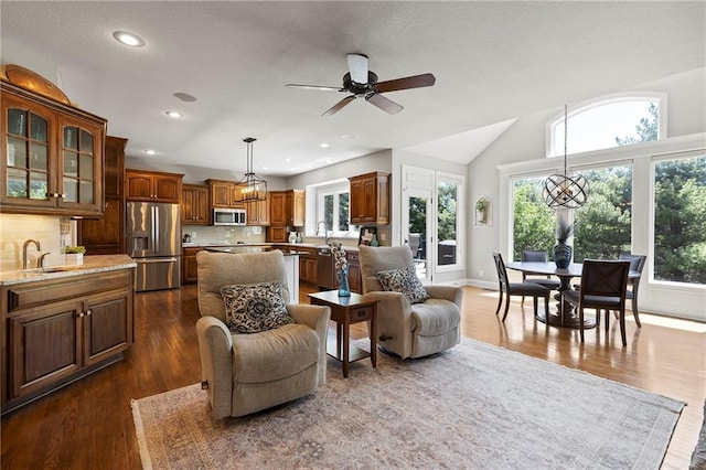 8701 W 157th St, Overland Park, KS 66221 - living room with plenty of natural light, dark wood-type flooring, recessed lighting, and lofted ceiling