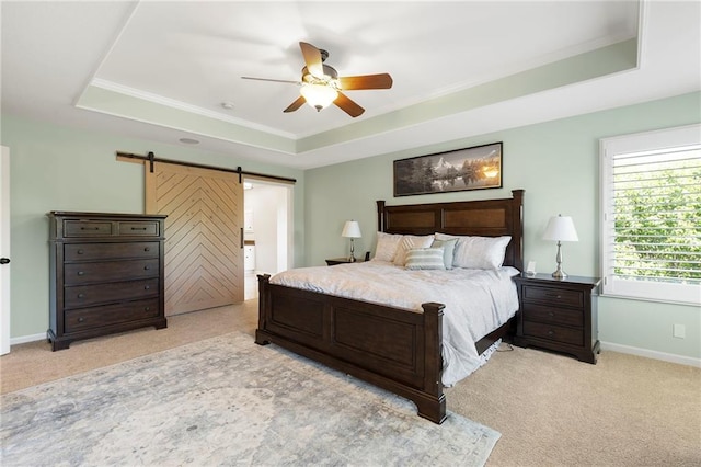 8701 W 157th St, Overland Park, KS 66221 - bedroom with a tray ceiling, a barn door, light colored carpet, baseboards, and ornamental molding
