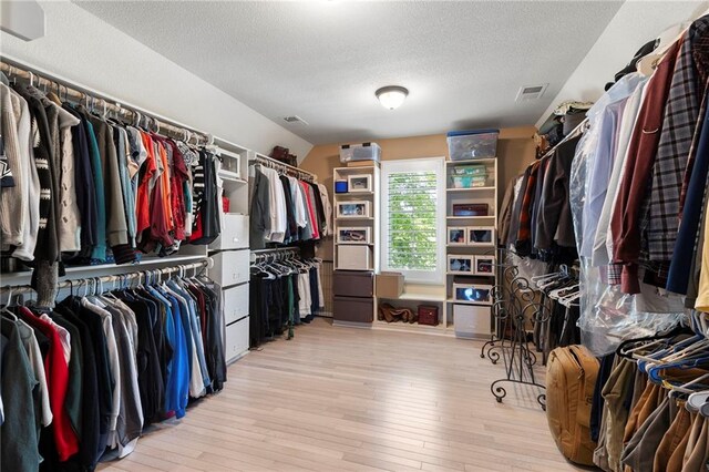 8701 W 157th St, Overland Park, KS 66221 - walk in closet with light wood-style flooring