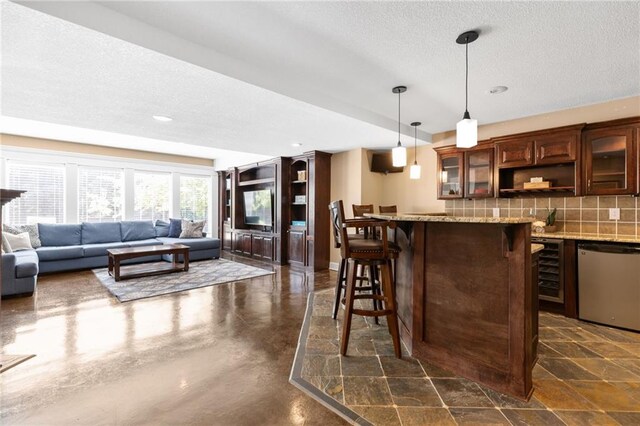 8701 W 157th St, Overland Park, KS 66221 - indoor wet bar with stainless steel dishwasher, a textured ceiling, backsplash, pendant lighting, and recessed lighting