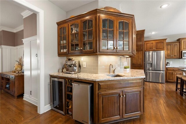 8701 W 157th St, Overland Park, KS 66221 - bar featuring stainless steel appliances, wine cooler, a sink, dark wood-style flooring, and tasteful backsplash
