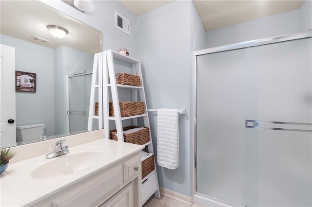 8701 W 157th St, Overland Park, KS 66221 - bathroom with toilet, a stall shower, vanity, baseboards, and tile patterned flooring
