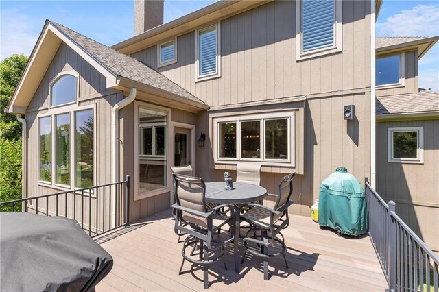 8701 W 157th St, Overland Park, KS 66221 - wooden terrace featuring outdoor dining area and area for grilling