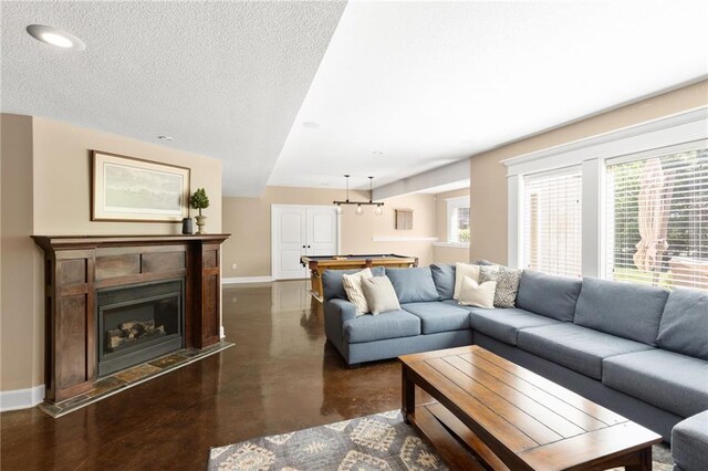 8701 W 157th St, Overland Park, KS 66221 - living room with baseboards, finished concrete flooring, healthy amount of natural light, billiards, and recessed lighting