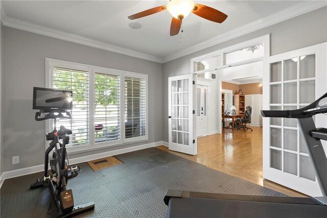 8701 W 157th St, Overland Park, KS 66221 - workout area with french doors, crown molding, baseboards, a ceiling fan, and wood finished floors