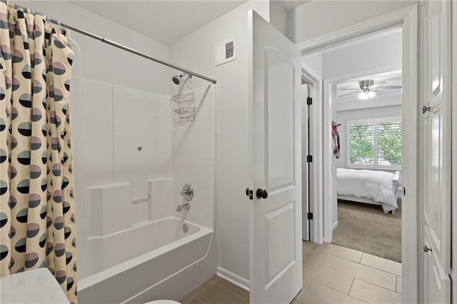8701 W 157th St, Overland Park, KS 66221 - full bath featuring shower / bathtub combination with curtain, connected bathroom, tile patterned floors, and a ceiling fan