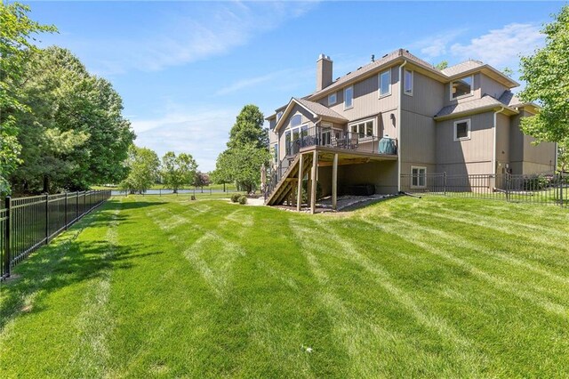 8701 W 157th St, Overland Park, KS 66221 - rear view of house with stairs, a wooden deck, and a chimney
