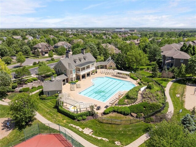 8701 W 157th St, Overland Park, KS 66221 - aerial perspective of suburban area with a pool area and a tree filled landscape