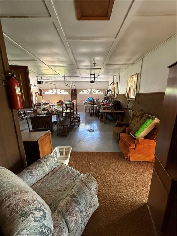 living area with concrete flooring