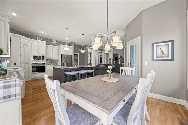 14692 S Garnett St, Olathe, KS 66062 - dining room featuring light wood finished floors and recessed lighting