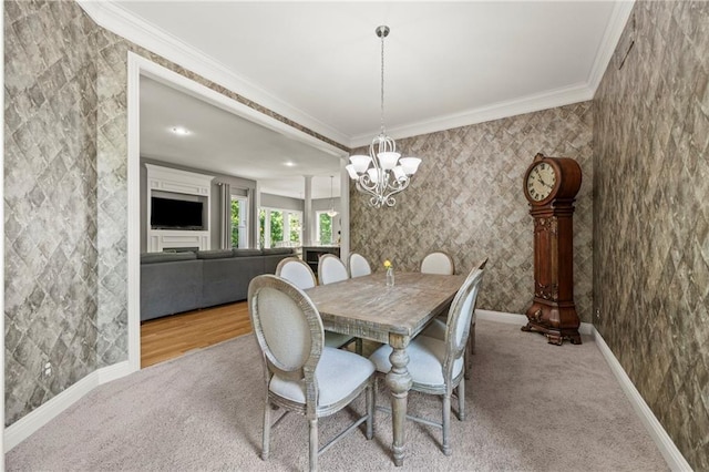 14692 S Garnett St, Olathe, KS 66062 - dining space featuring crown molding, a chandelier, and carpet flooring