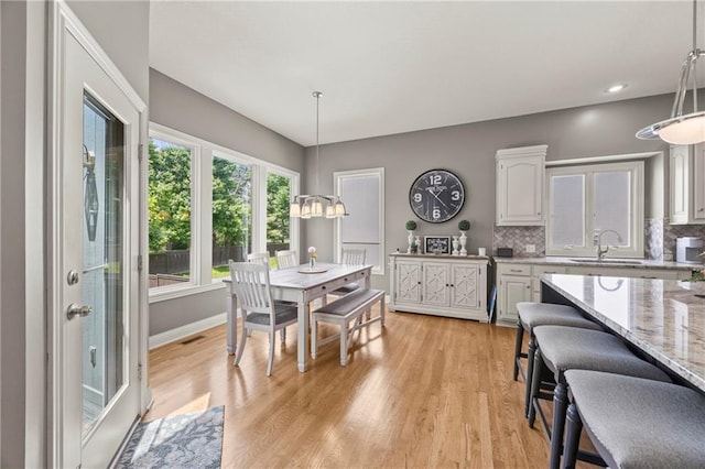 14692 S Garnett St, Olathe, KS 66062 - dining space with light wood-type flooring and recessed lighting