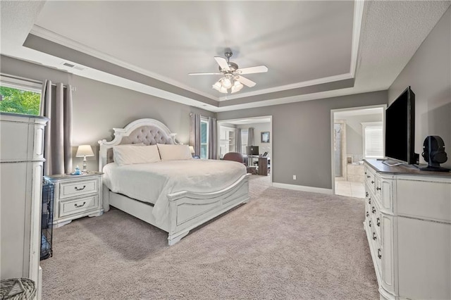 14692 S Garnett St, Olathe, KS 66062 - bedroom with a tray ceiling, light carpet, ensuite bath, a ceiling fan, and crown molding