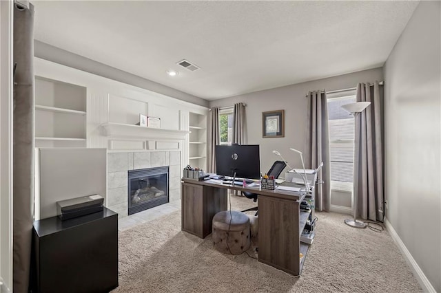 14692 S Garnett St, Olathe, KS 66062 - carpeted office space with a tile fireplace and a textured ceiling