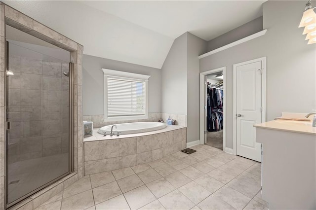 14692 S Garnett St, Olathe, KS 66062 - bathroom featuring a bath, vanity, a stall shower, tile patterned floors, and a walk in closet