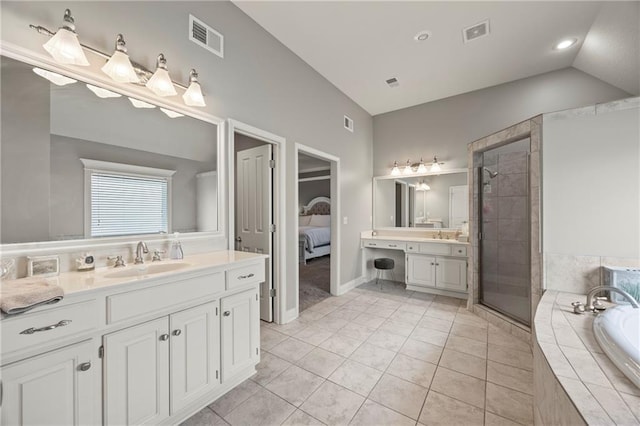 14692 S Garnett St, Olathe, KS 66062 - full bathroom with vanity, a shower stall, a garden tub, ensuite bath, and tile patterned floors