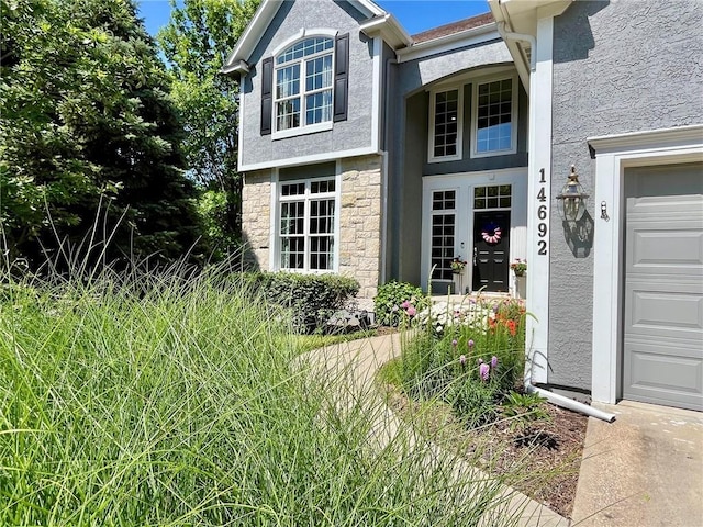14692 S Garnett St, Olathe, KS 66062 - view of exterior entry with stucco siding and stone siding