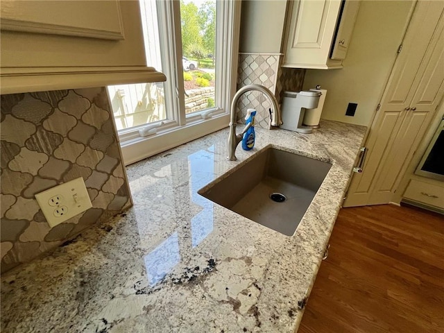 14692 S Garnett St, Olathe, KS 66062 - kitchen featuring light stone countertops and wood finished floors