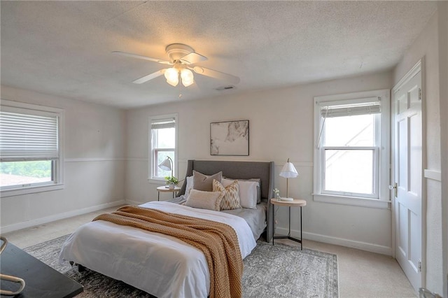 722 E Meyer Blvd, Kansas City, MO 64131 - bedroom with carpet flooring, a ceiling fan, and a textured ceiling