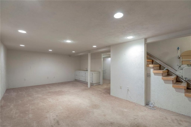 722 E Meyer Blvd, Kansas City, MO 64131 - finished below grade area with recessed lighting, light carpet, and stairs