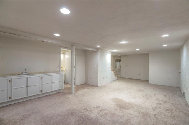 722 E Meyer Blvd, Kansas City, MO 64131 - finished below grade area with recessed lighting, stairway, and light colored carpet