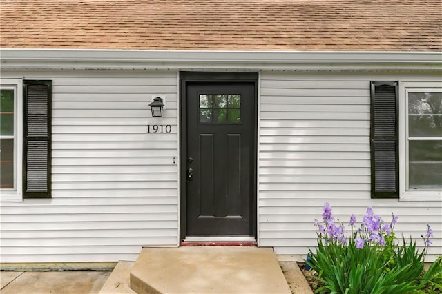 1910 Ottawa St, Leavenworth, KS 66048 - doorway to property featuring roof with shingles