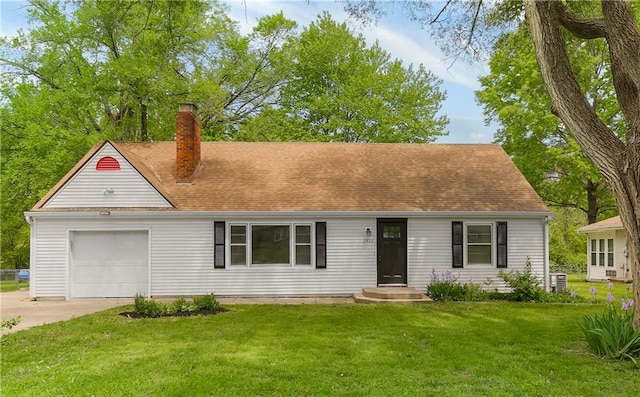 1910 Ottawa St, Leavenworth, KS 66048 - cape cod house with a chimney, concrete driveway, a garage, and a front yard