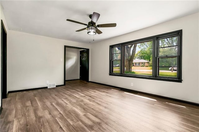1910 Ottawa St, Leavenworth, KS 66048 - spare room with wood finished floors, baseboards, and ceiling fan