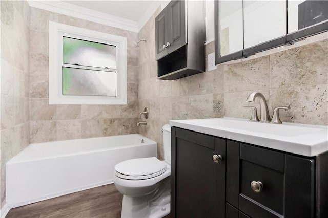 1910 Ottawa St, Leavenworth, KS 66048 - full bath featuring toilet, vanity, ornamental molding, bathtub / shower combination, and wood finished floors